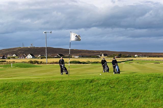 Golfers on Slope
